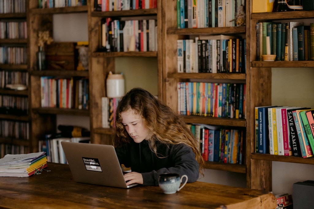 child using a learning app during home schooling